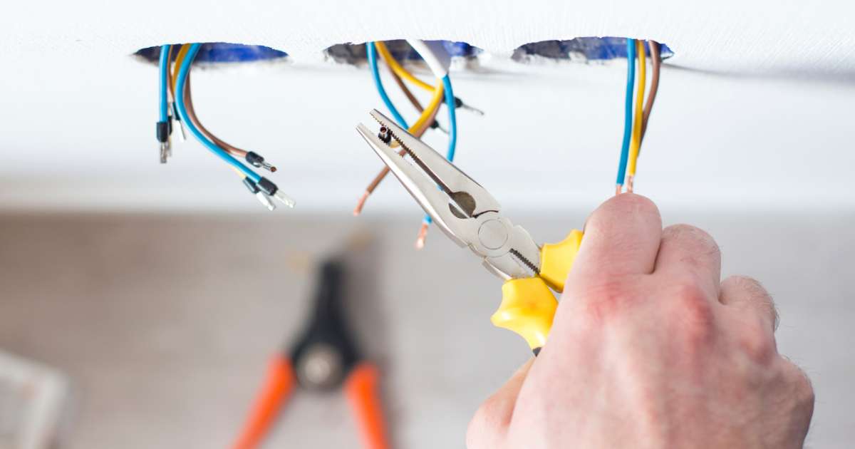 electrician working on light fixtures