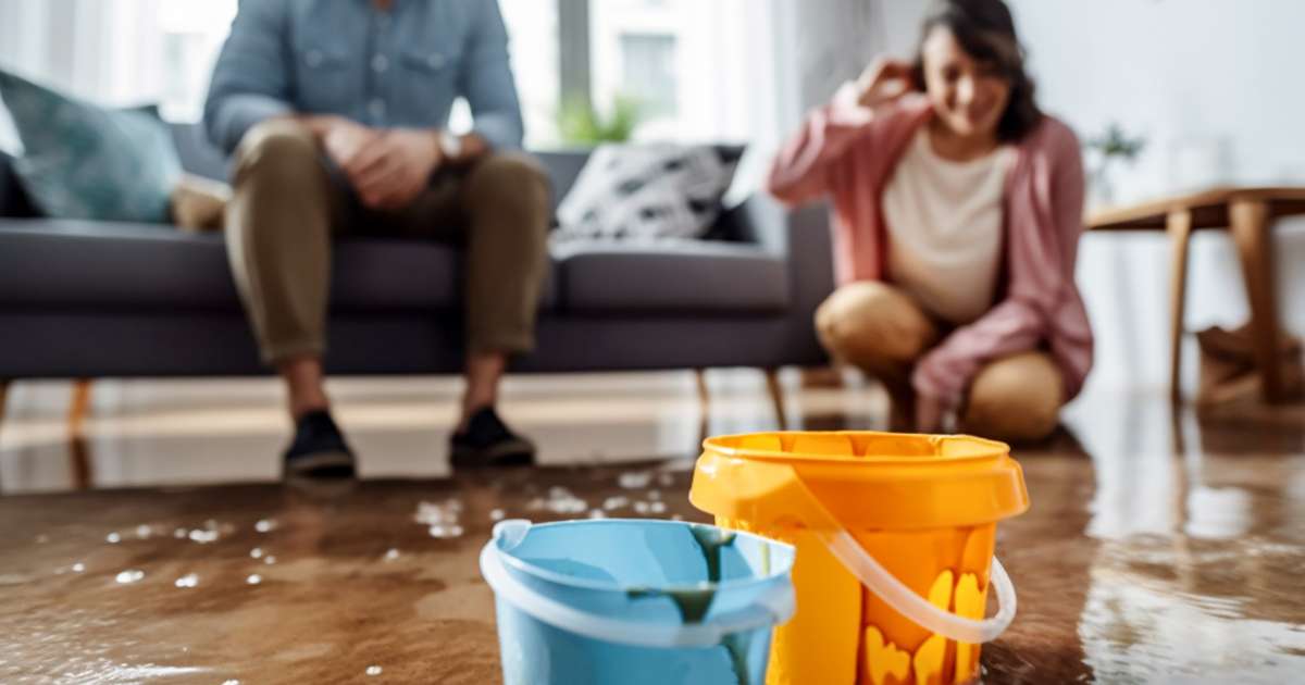 couple with flooded house