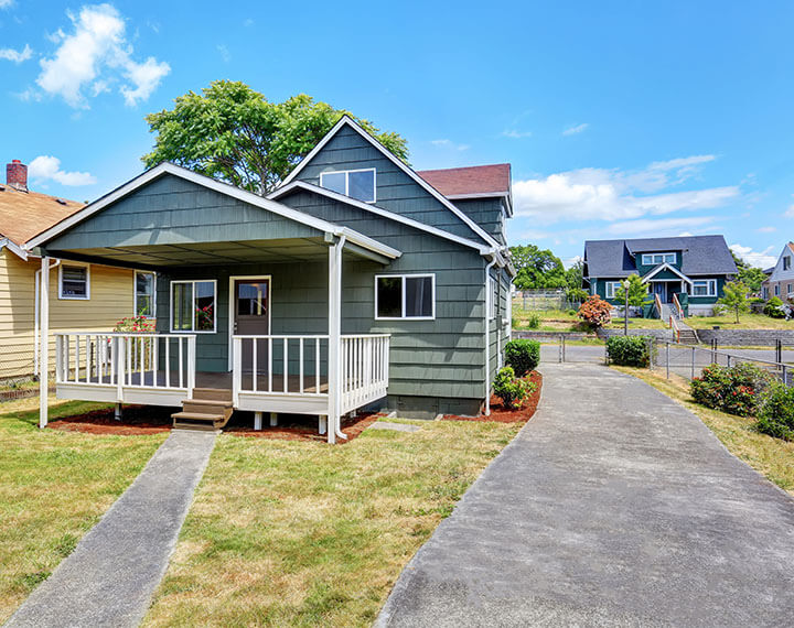 green wooden suburban house