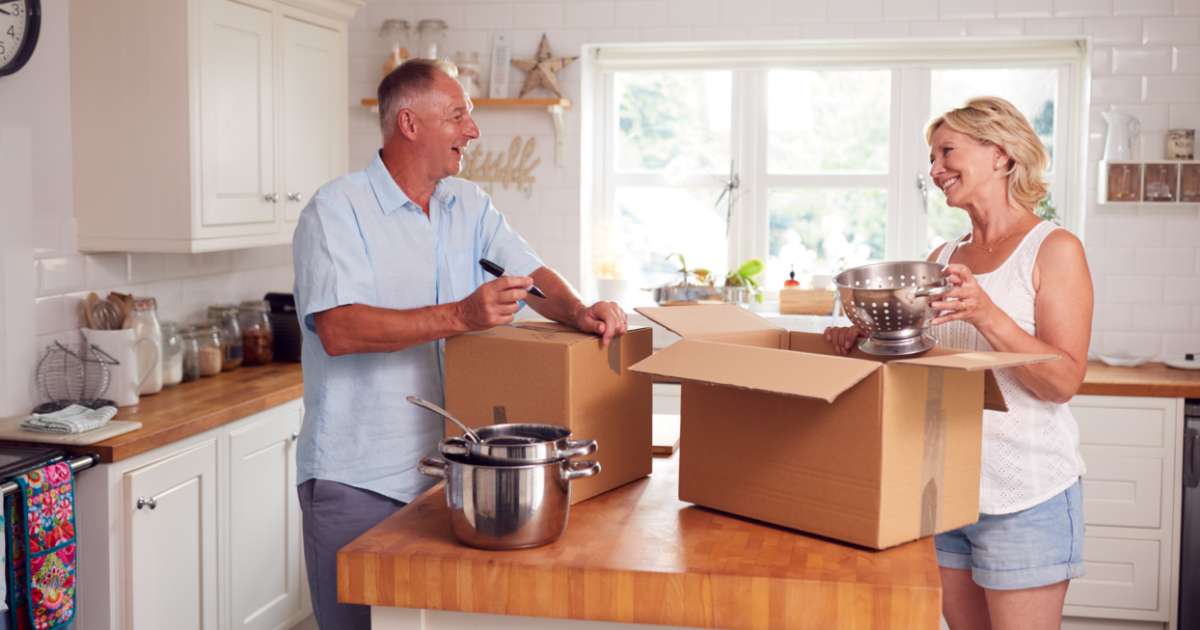 couple packing moving boxes