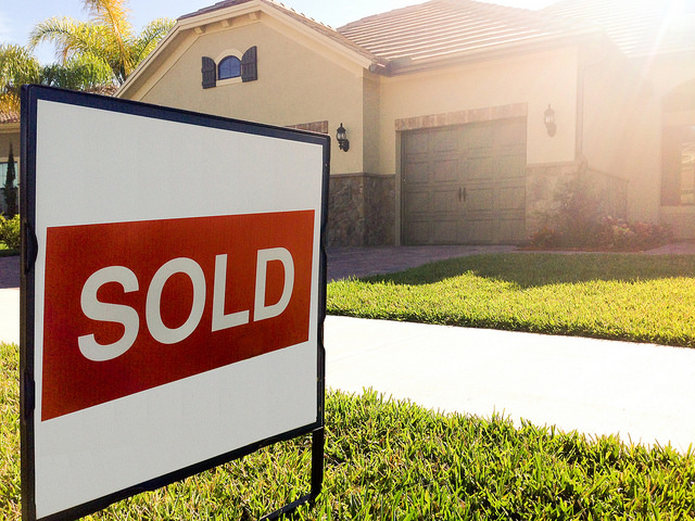 sold sign in front of house