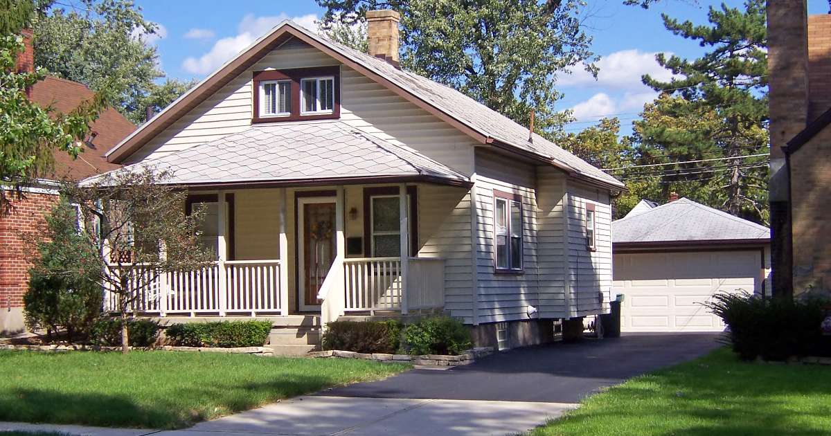 cream house with brown accents