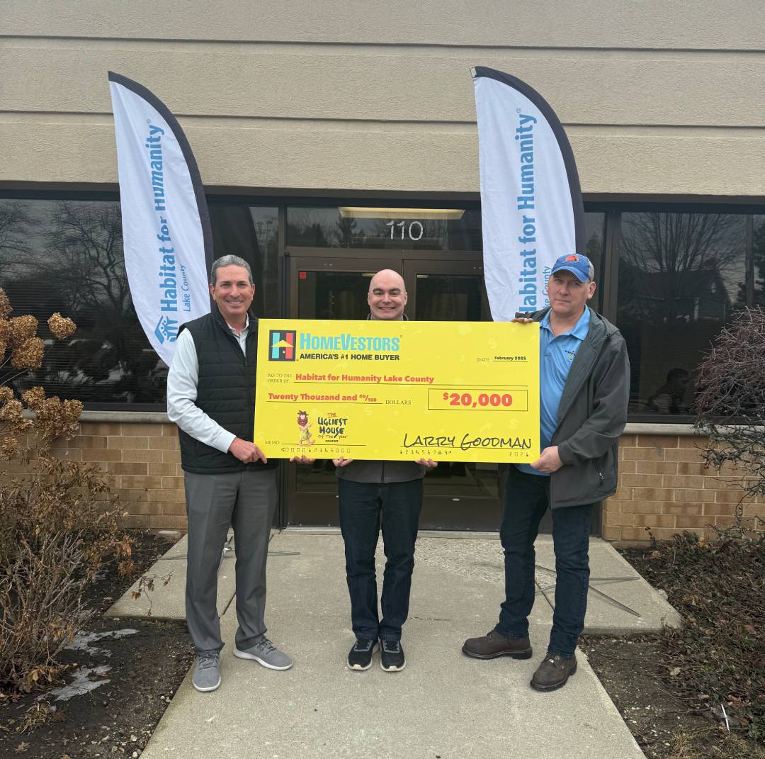 We Buy Ugly Houses presents big check to Lake-McHenry Habitat for Humanity