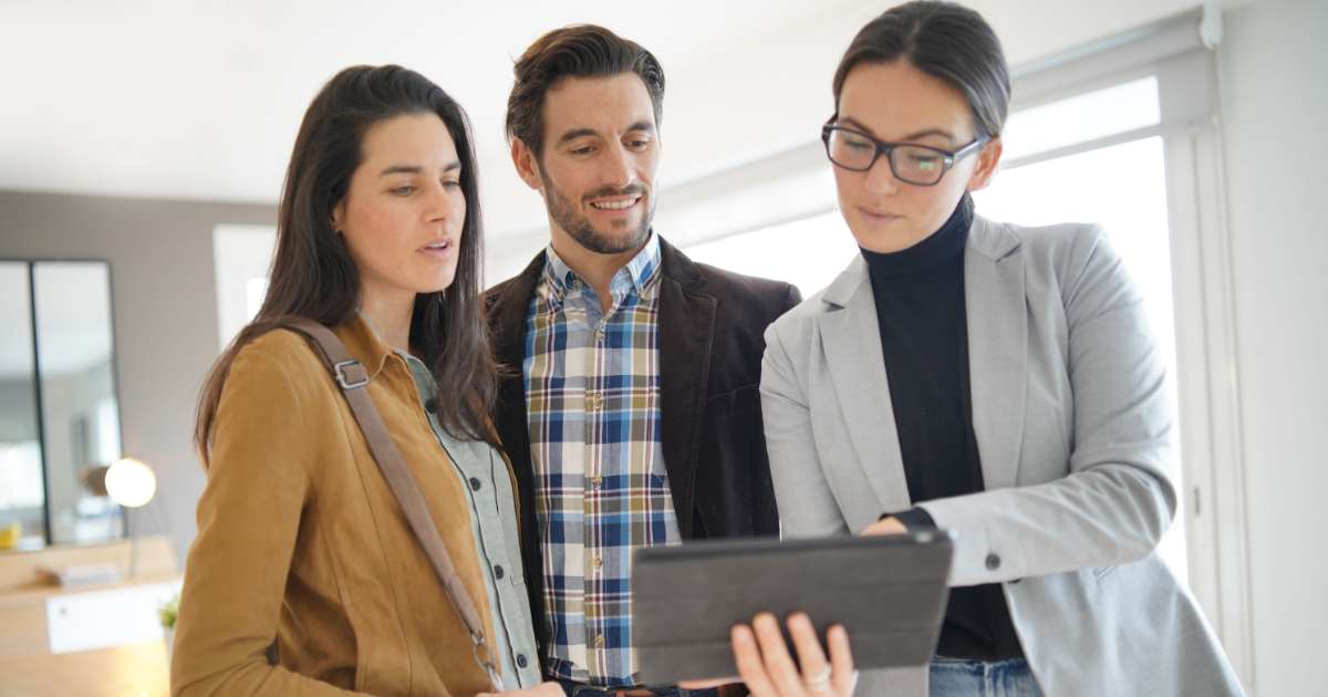 couple talking to real estate investor